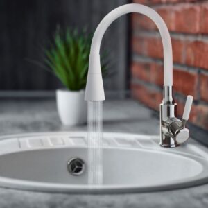 Water flowing from faucet to sink