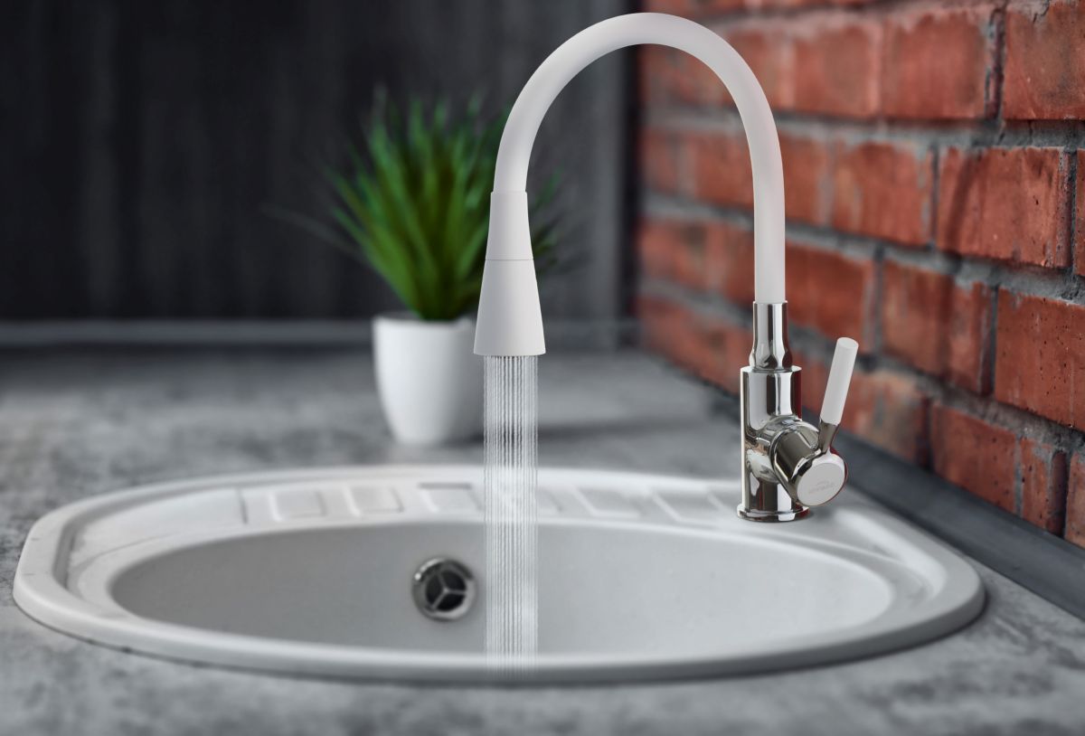 Water flowing from faucet to sink